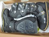 a box with a pair of motorcycle gloves in it