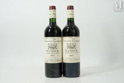 deux bouteilles de vin posées l'une à côté de l'autre sur une surface blanche