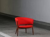 a red chair that is sitting in the middle of a room