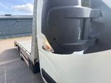 a white truck with a flat bed on the back of it