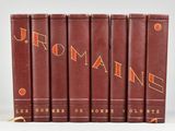 six books in red leather covers with orange lettering on them