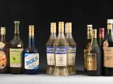 many different types of alcohol bottles lined up on a table