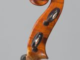 an old violin with a wooden back and a long neck