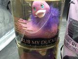 a purple duck in a bucket next to a purple duck in a can