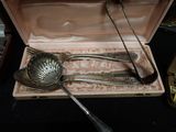 two spoons and two spoons in a case