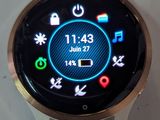 a smart watch on display on a white surface