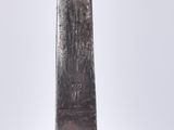 a close up of a knife with a wooden handle