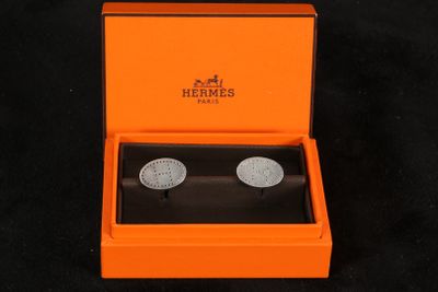an image of a pair of cuff watches in an orange box