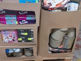 two cardboard boxes with items in them sitting on a pallet