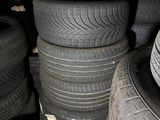 several tires stacked on top of each other in a garage