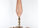 a bird feeder with a bird sitting on top of it