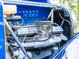 a close up of a blue car with an engine in it