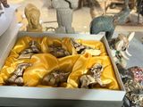 a box with a bunch of figurines inside of it