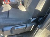 a seat in the back of a car with a cell phone in it