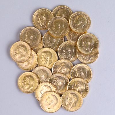 a pile of gold coins sitting on a white surface