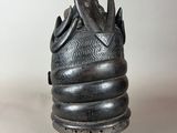 an image of a statue of a snake wrapped around a bowl