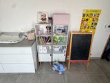 a small kitchen with a refrigerator, stove, cabinets, and a refrigerator freezer