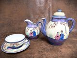a tea pot and a tea cup on a table