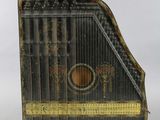 a black and gold musical instrument on a white background