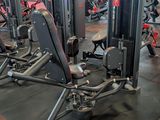 a gym with a lot of machines in the room