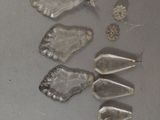 several pieces of ice sitting on top of a table next to a pair of scissors