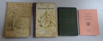 three old books sitting on a table next to each other