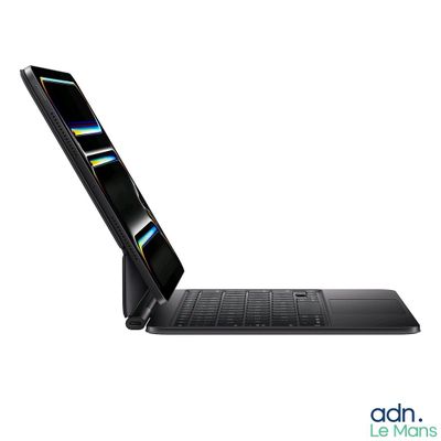 a laptop that is open on a white surface