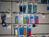 many different colored beads on the shelves in the store