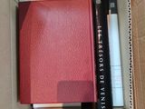 a book in a box with a pen in it