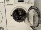 a washer and a dryer in a small room