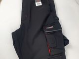 men ' s black work pants with red stitching and zippers