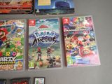 several nintendo wii games are sitting on a table next to each other