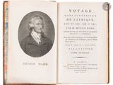 an old book with a picture of a man in a suit and tie