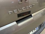 a close up of the rear end of a silver car