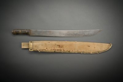an image of a knife and a knife sheath on a table
