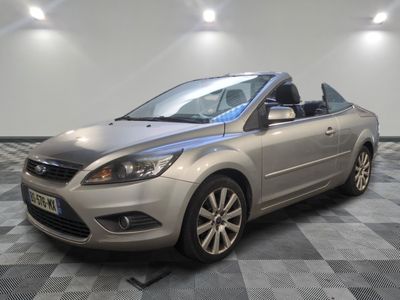a picture of a silver car parked in a garage