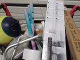 a box full of pens and other things in it