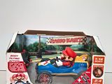 a box with a toy car in it on a table