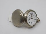 an image of a silver pocket watch with roman numerals on the face