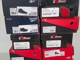 several boxes of shoes are stacked on top of each other