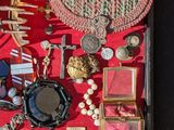 a box of assorted items on a red surface