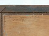 painting of a wooden frame with writing on the bottom of it