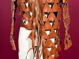 an image of a mannequin made of leather with triangles on it