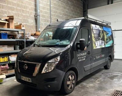 a black van that is parked in a garage