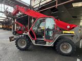 a red crane that is parked in a parking lot