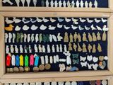 a display case with a lot of different figurines on it