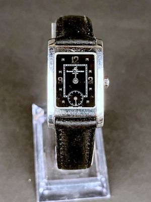 an image of a watch on display on a clear stand