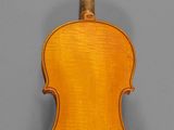 an old violin with a wooden back and bow
