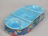 a blue tray with two bowls in it on a table