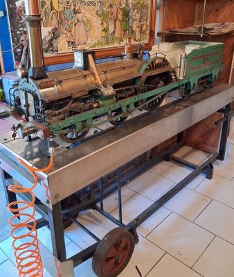 an old model train sitting on a table in a room